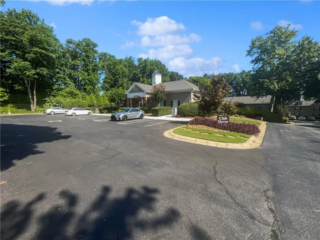 View of front of house featuring uncovered parking and a residential view