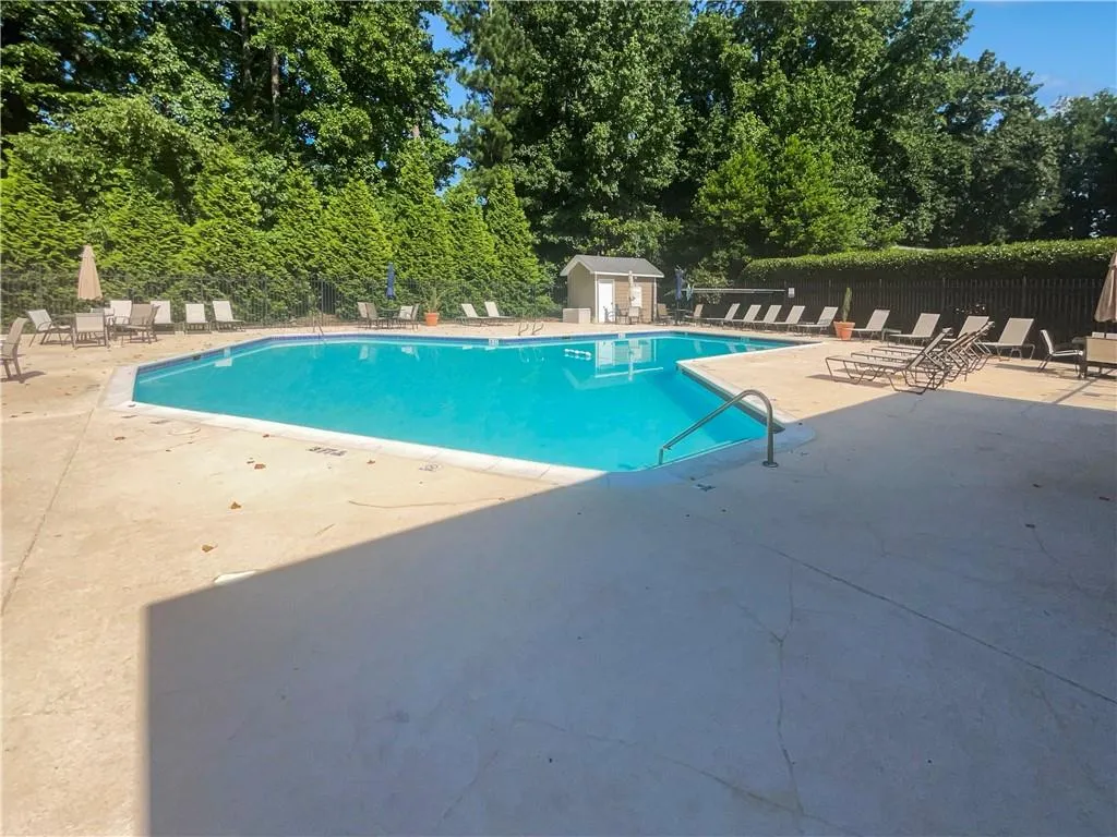 Community pool featuring a patio area