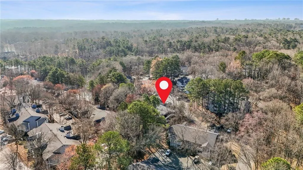 Aerial view of residential area with a forest