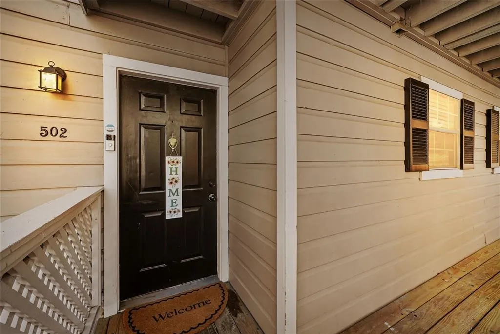 Property entrance featuring covered porch