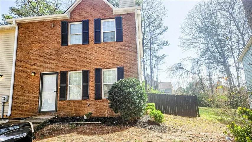 View of front of property with brick siding