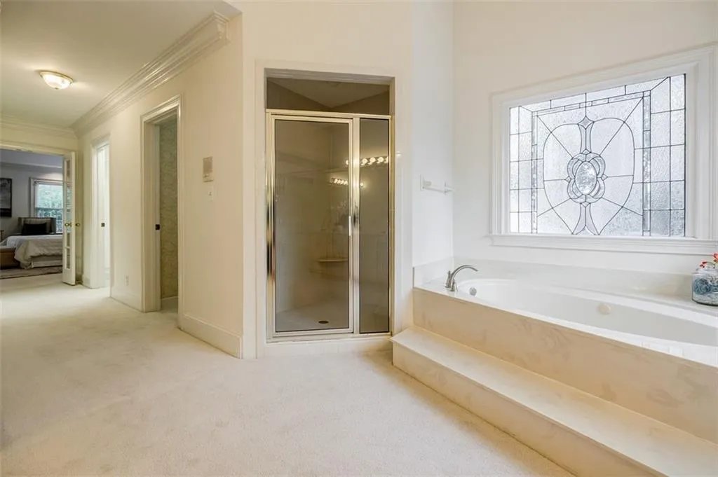 Primary bath features dual walk-in closets, linen closet & separate water closet.