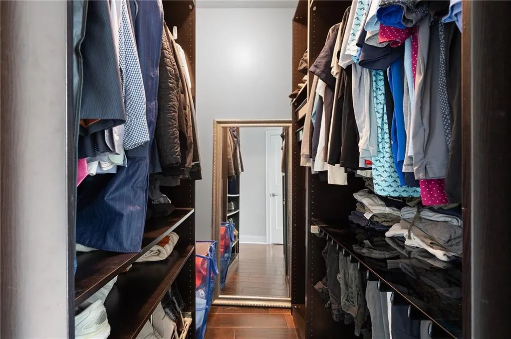 Spacious closet featuring wood finished floors