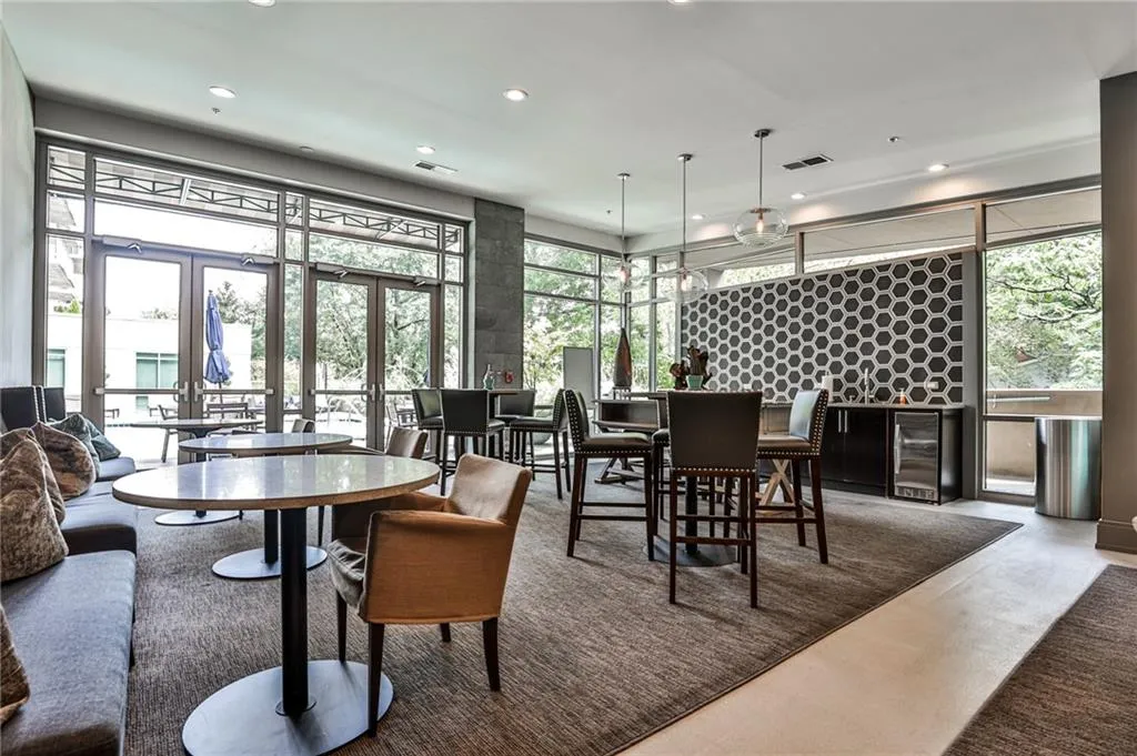 Dining room with wine cooler, recessed lighting, and french doors