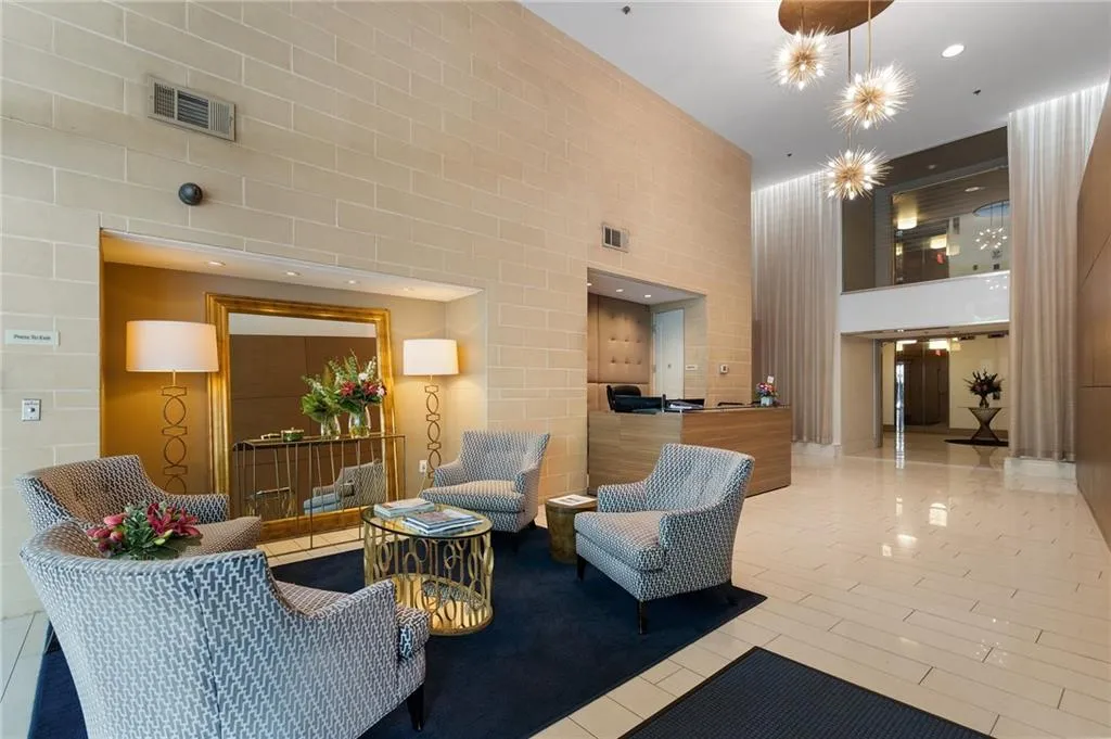 Community lobby with a high ceiling and recessed lighting