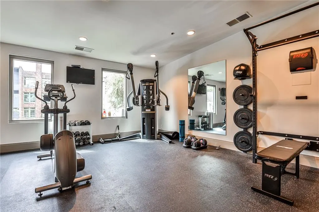 Exercise area featuring plenty of natural light and recessed lighting