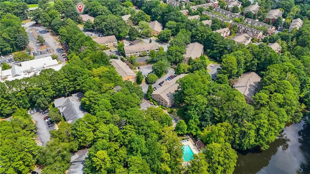 View of property location featuring community pool and lake