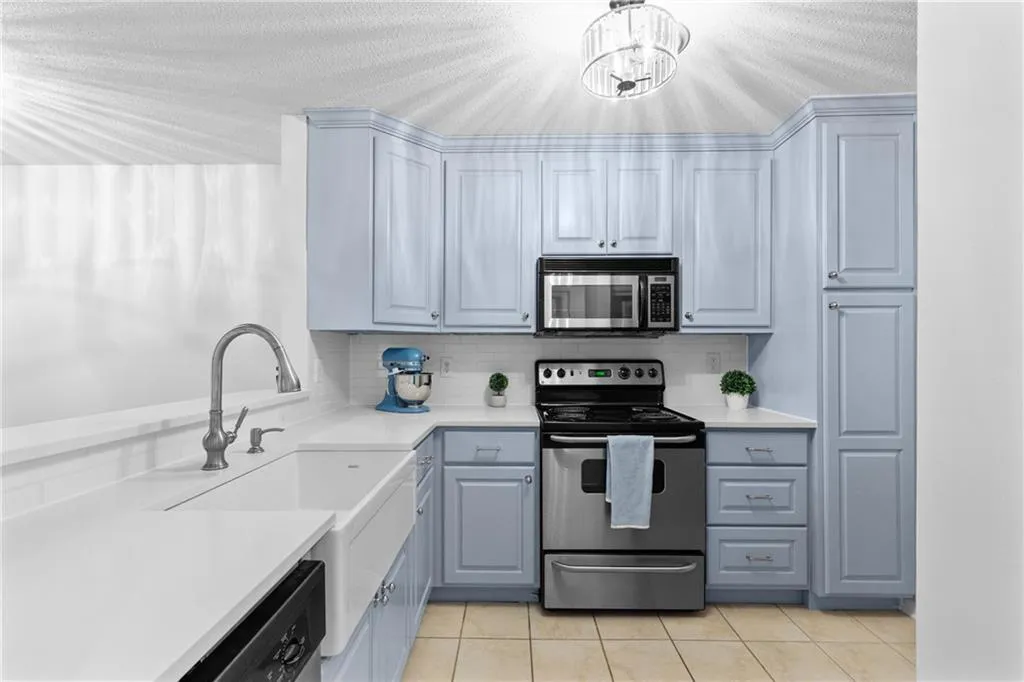 Kitchen with Stainless Steel appliances, electric oven, microwave and dishwasher