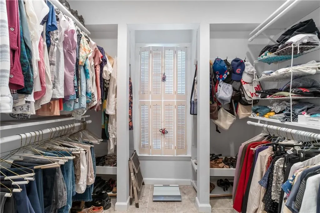 Walk in closet featuring tile floors