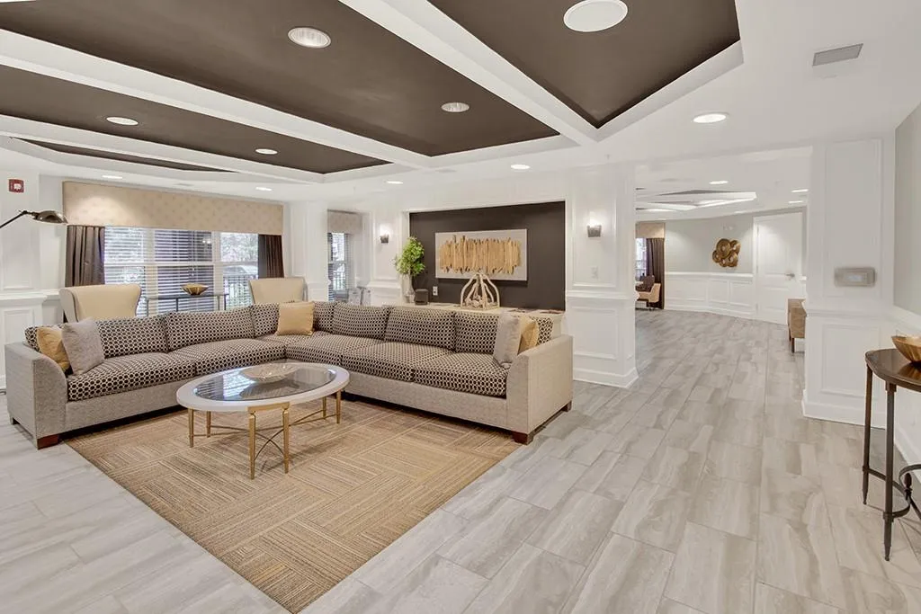 Living room featuring a raised ceiling