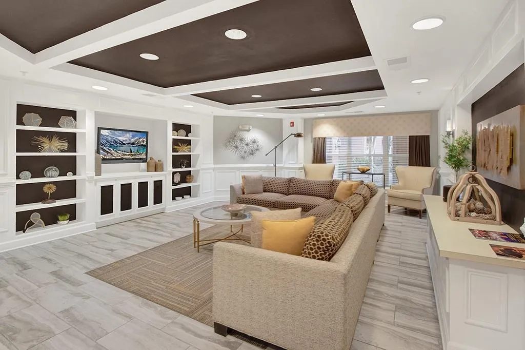 Living room featuring a tray ceiling
