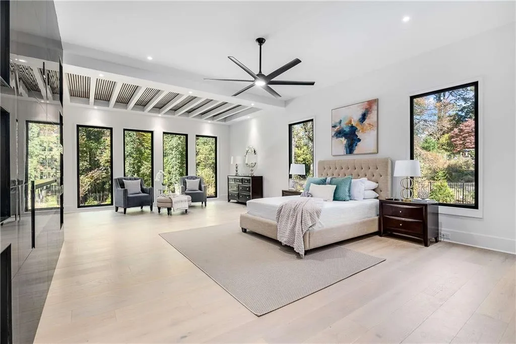 Bedroom featuring light wood-style floors, ceiling fan, recessed lighting, and beam ceiling