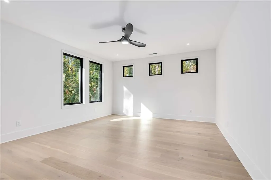 Unfurnished room featuring light wood finished floors, recessed lighting, and a ceiling fan