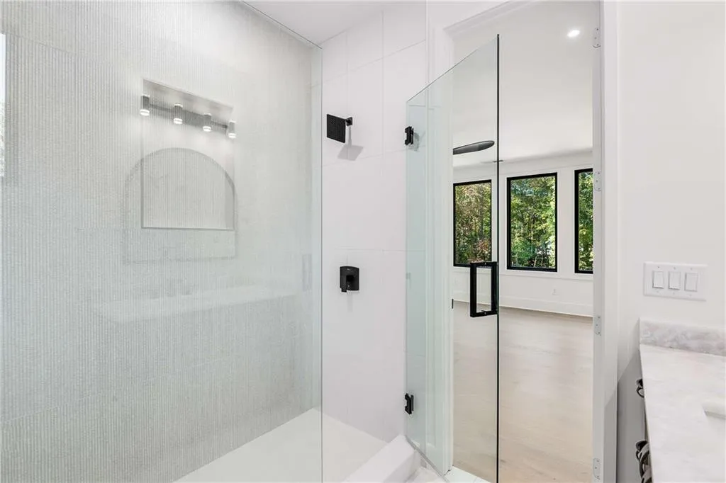 Bathroom featuring vanity and walk in shower