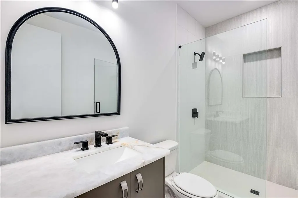 Full bath with walk in shower and vanity