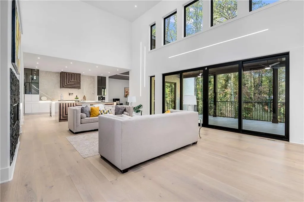 Living area featuring light wood-style floors and recessed lighting