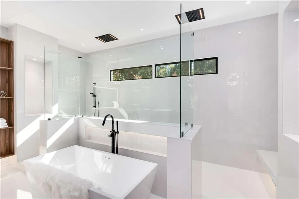Full bathroom featuring a soaking tub and walk in shower