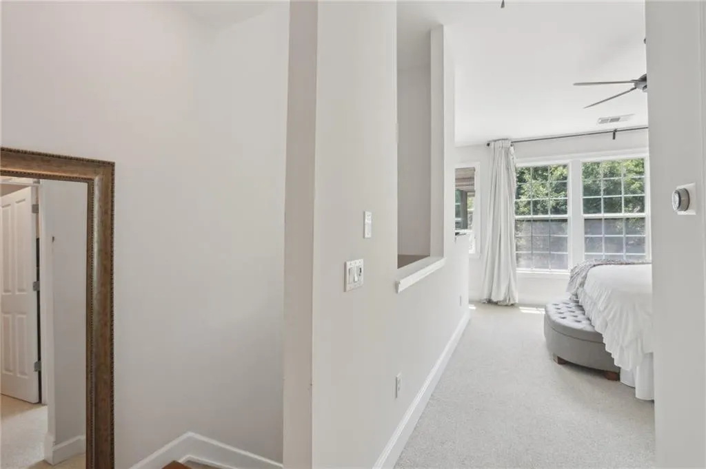 Bedroom with baseboards and carpet flooring