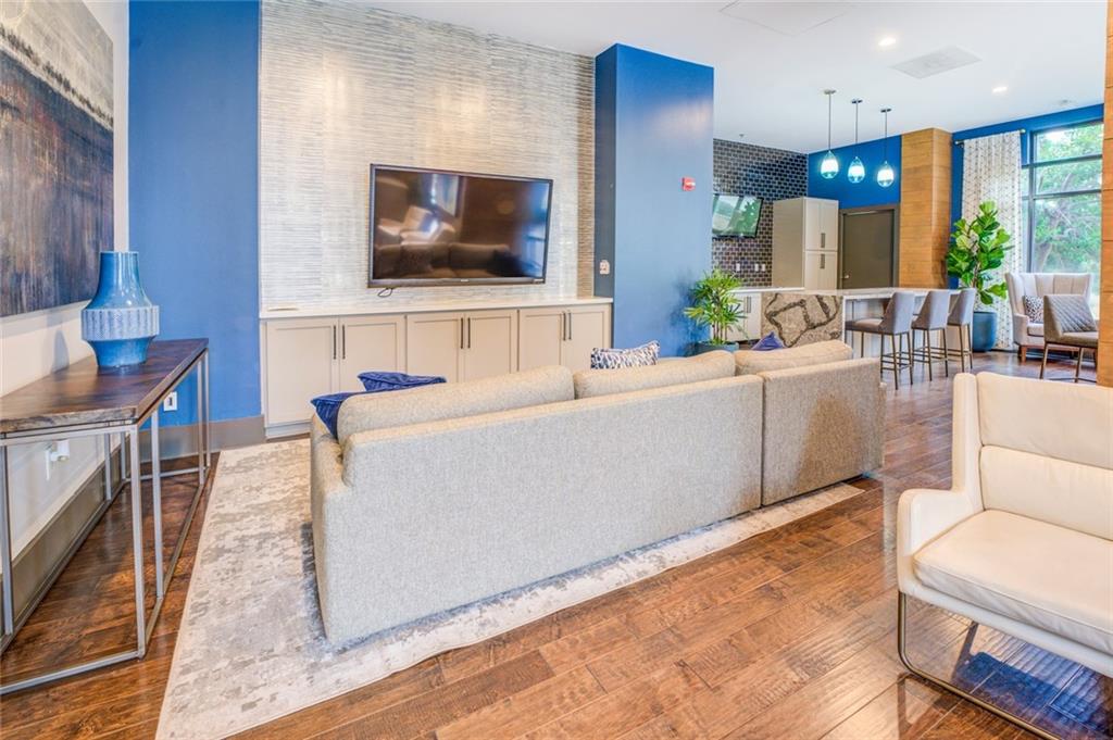 Living room with dark hardwood / wood-style flooring