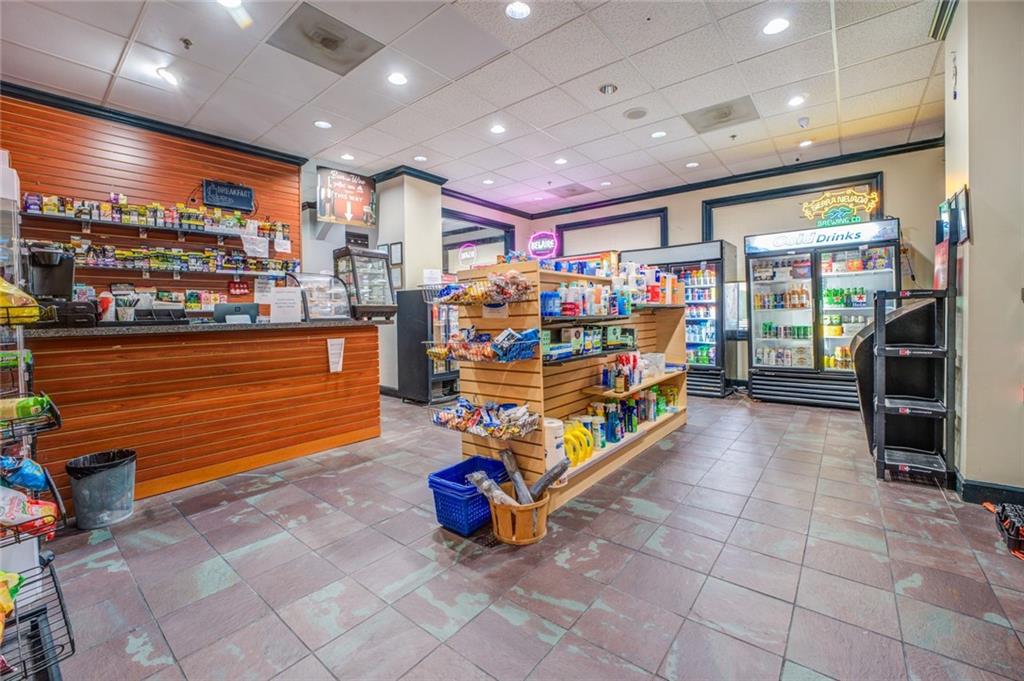 Game room with crown molding and tile floors