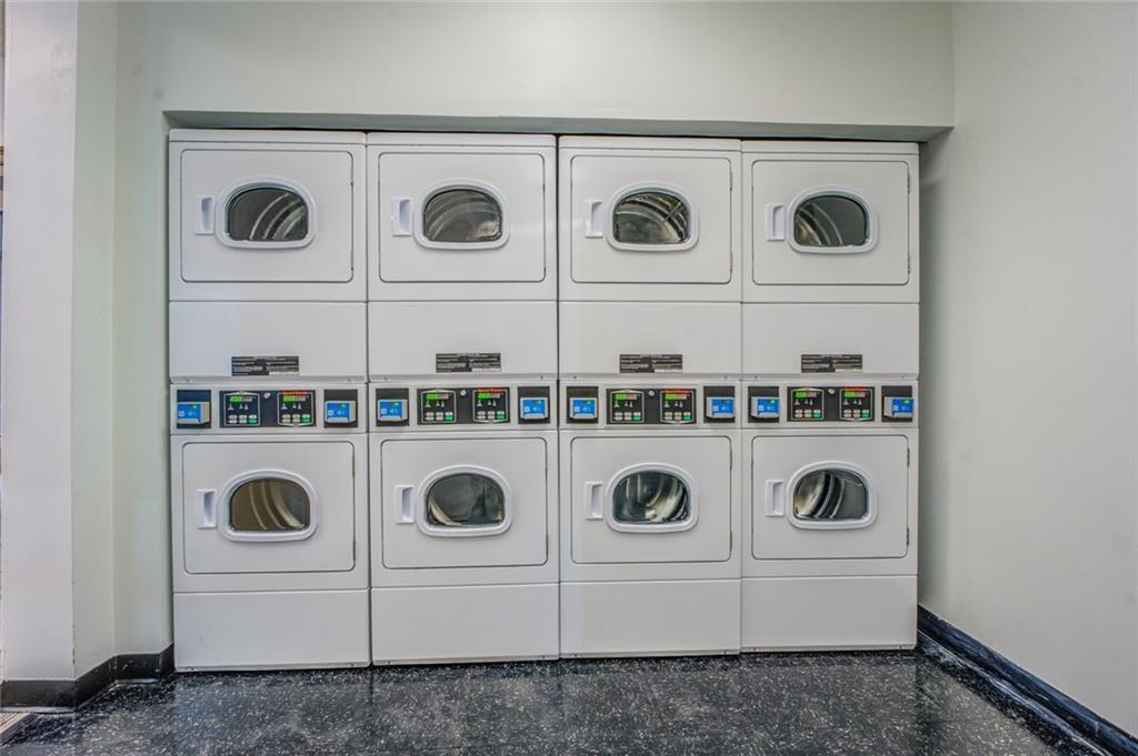 Laundry area featuring washing machine and clothes dryer and stacked washer / drying machine