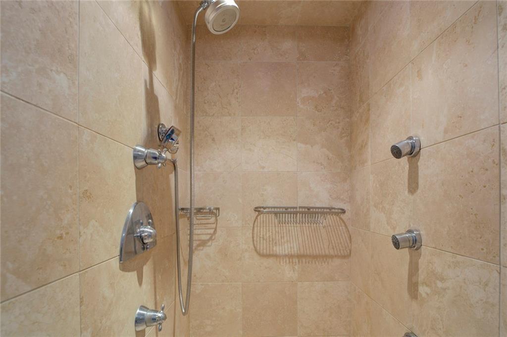 Interior details featuring tiled shower