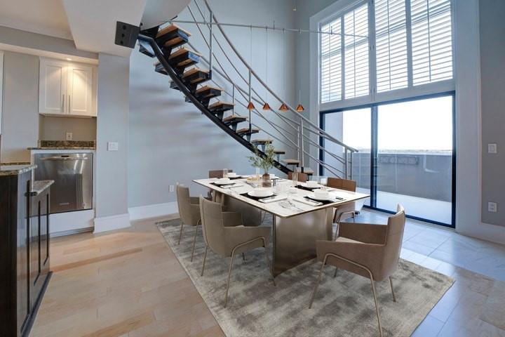 Dining space with a high ceiling