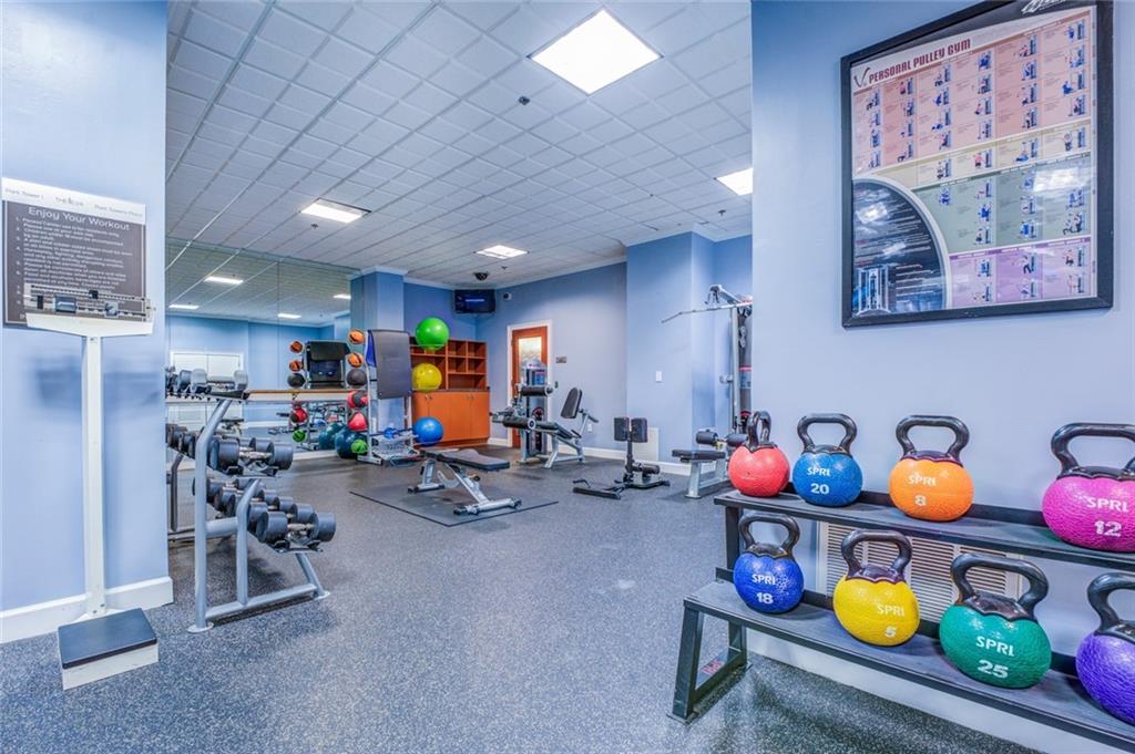 Workout area featuring a paneled ceiling