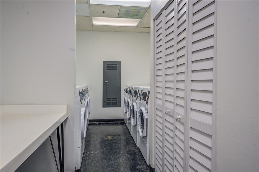 Washroom featuring washing machine and clothes dryer