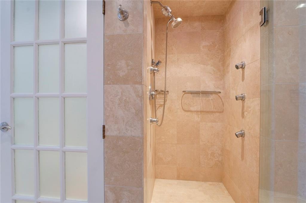 Bathroom with a shower with door