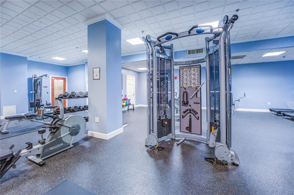 Exercise room with a paneled ceiling