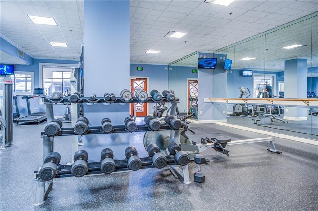 Workout area featuring a drop ceiling