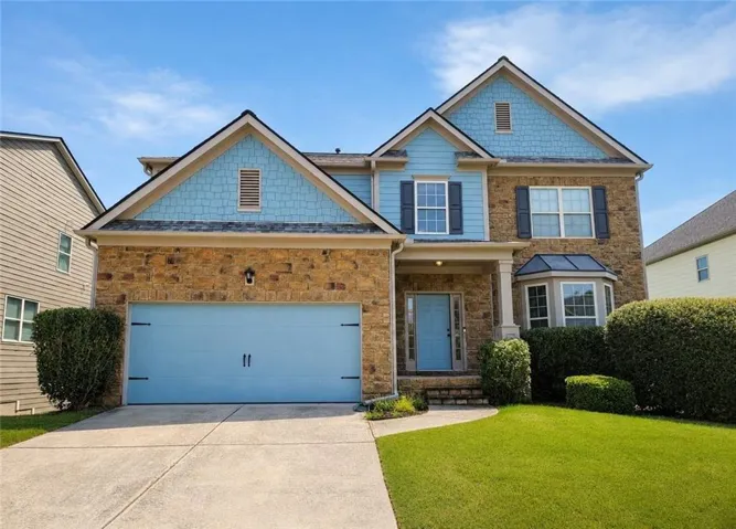 Stone and siding exterior with gabled roof lines