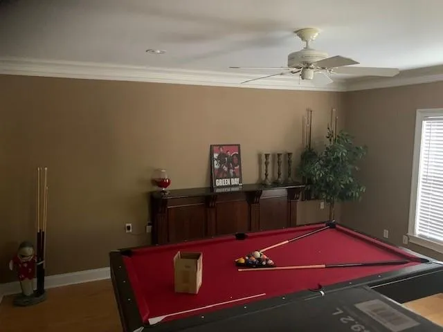 Rec room featuring ceiling fan, hardwood / wood-style flooring, ornamental molding, and billiards