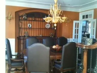 Dining area with a chandelier and ornamental molding