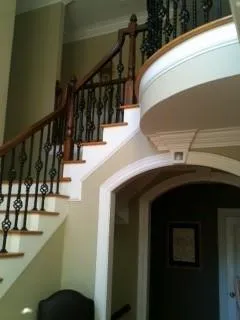 Staircase featuring ornamental molding