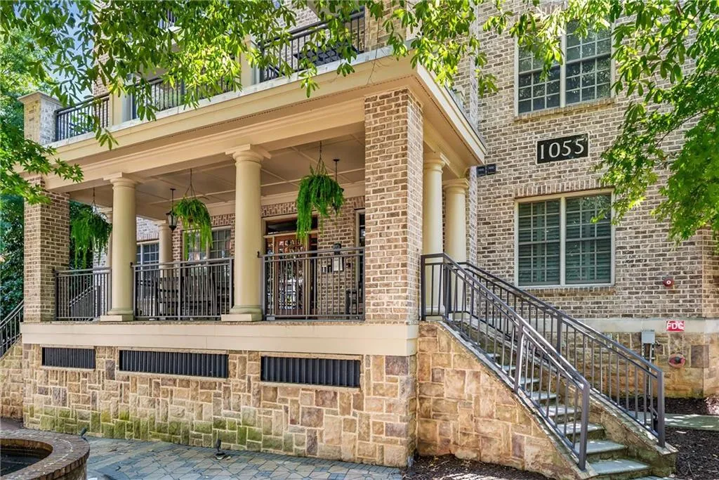 Doorway to property with brick siding