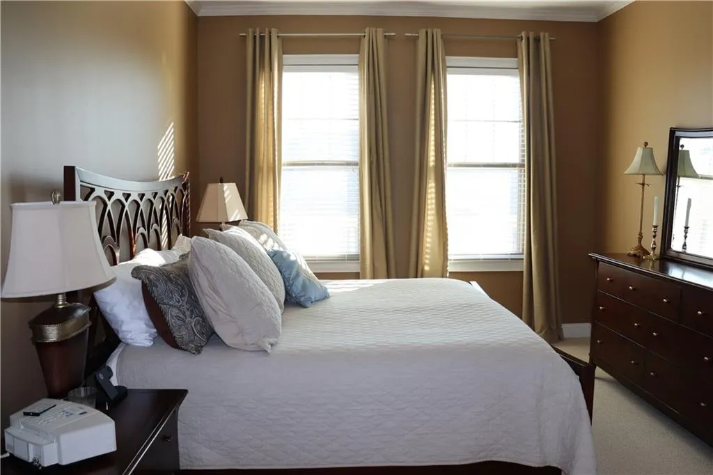 Owner's suite featuring large bath with separate tub and shower and large walk-in closet