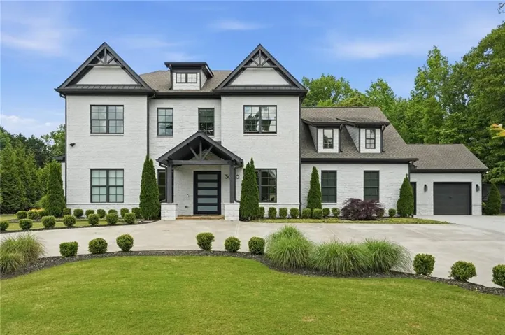 Contemporary brick exterior featuring a multi-gabled roofline and dark trim accents