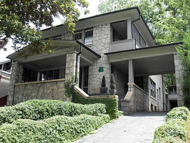 Granite Craftsman featuring a covered entry porch and porte-cochère