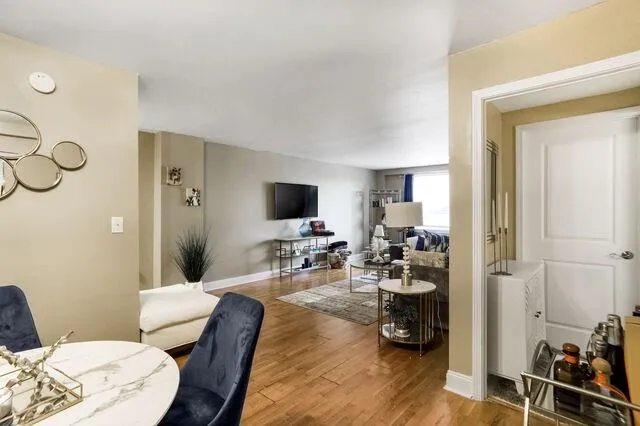Living room featuring wood finished floors and baseboards