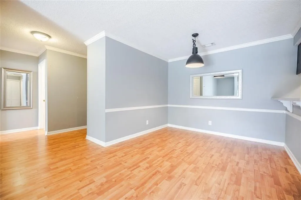The living, dining and kitchen feature hardwood floors.