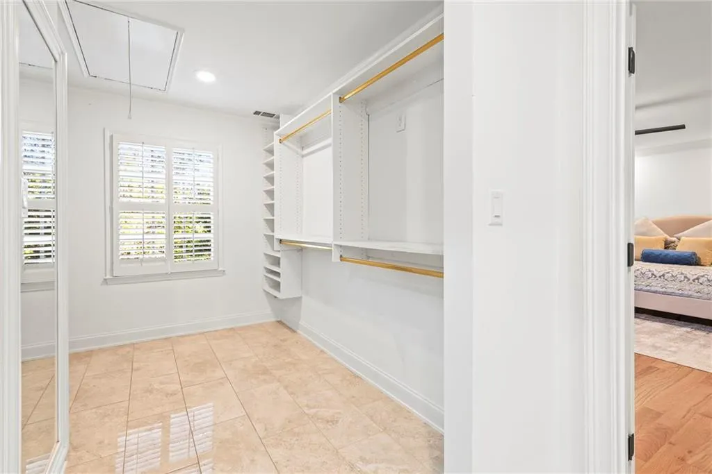 Spacious closet featuring light hardwood / wood-style floors