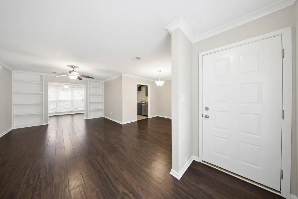 Light-filled, open-air floor plan featuring beautiful hardwood floors throughout the main living areas