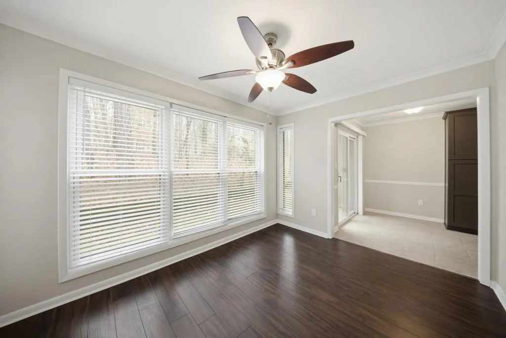 Wooded views from the wall of windows in the sunroom