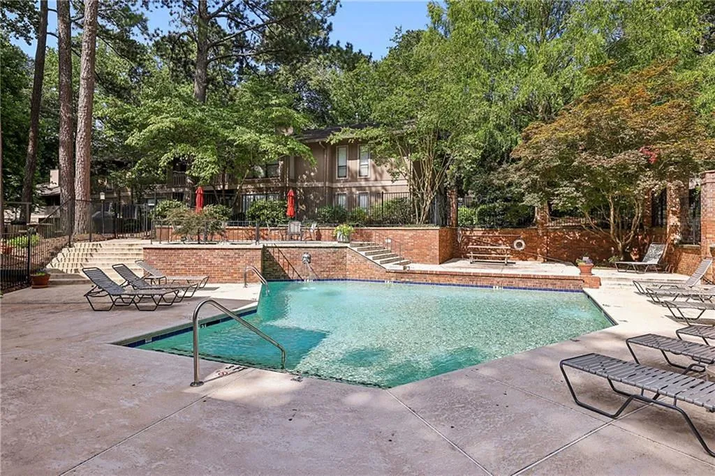 The tucked-away community also features wonderful amenities, including a sparkling pool, grilling area