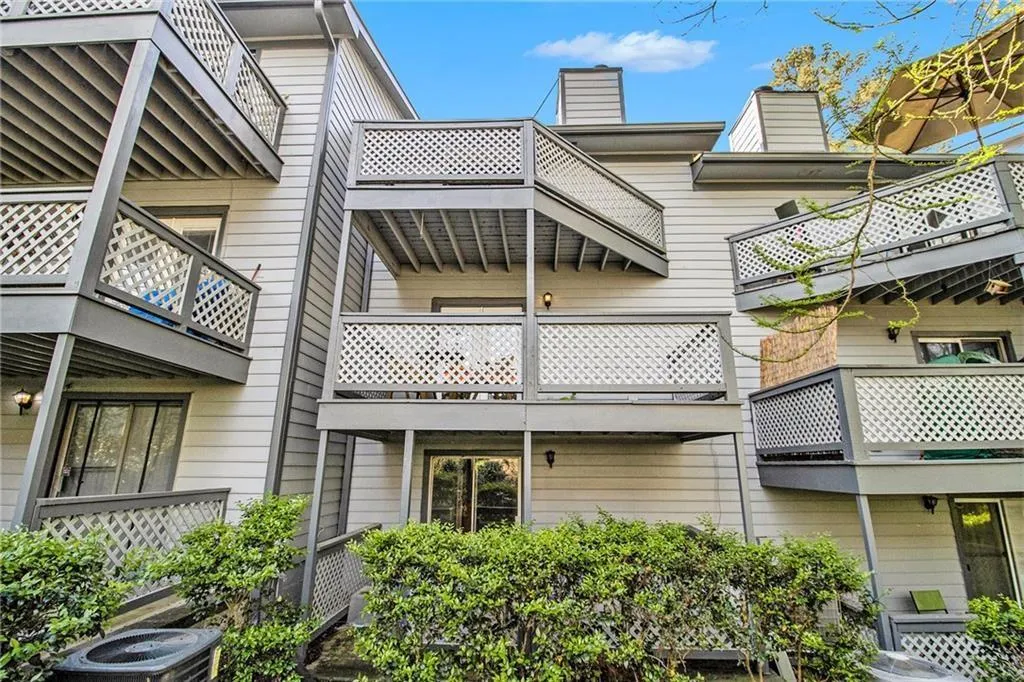 Multi-story exterior with horizontal siding and multiple private balconies