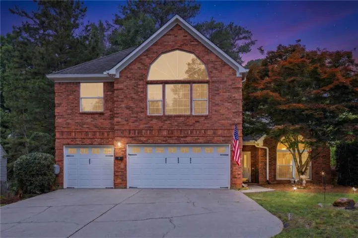 Brick facade residence with a two-car garage