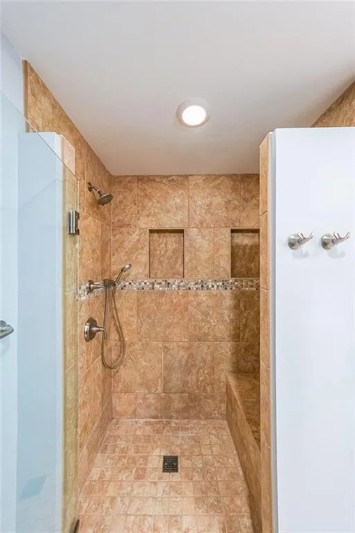 Bathroom with tiled shower