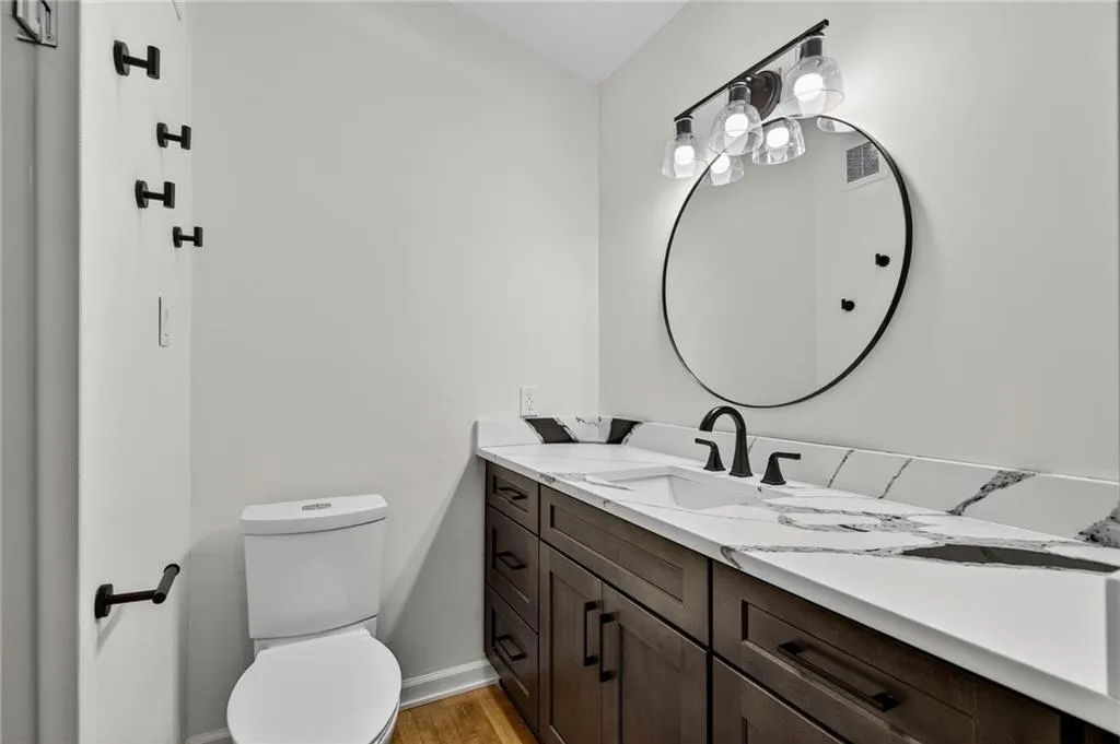 Bathroom with vanity and light wood finished floors